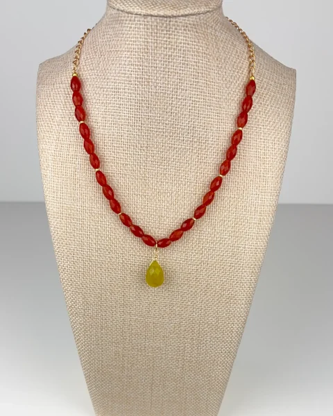 Olive Jade and Carnelian Statement Necklace on a linen display bust