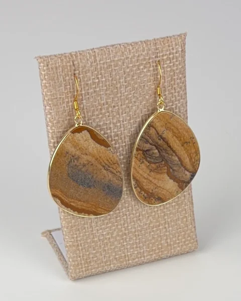 Picture Jasper Slice Earrings hanging on a linen earring display